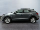 a grey volkswagen suv is parked in a garage