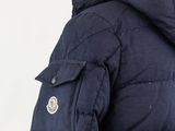 a close up of a person wearing a jacket with a hood