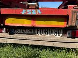 a red truck that is parked on the side of the road