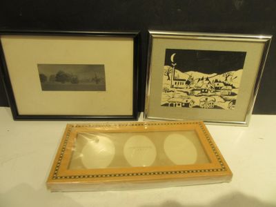 two framed pictures on the table next to each other