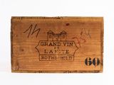 an old wooden crate with a sign that says grand vin latte route red