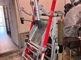 an image of a ladder in a garage that is being worked on