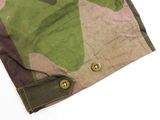 an image of a close up of a camouflage shirt on a white background