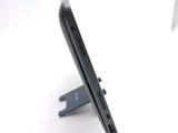 a close up of a cell phone on a stand