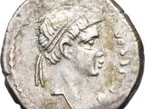 a silver coin with a woman ' s head on it