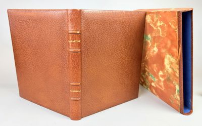 a brown book with a blue cover sitting open