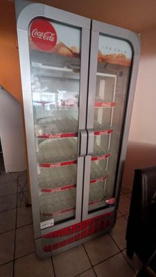 a refrigerator that has a lot of food inside of it