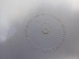 a white plate that has a circular design on it