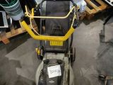 a lawn mower that is sitting on the floor