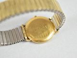 an image of a close up of a wrist watch on a white surface
