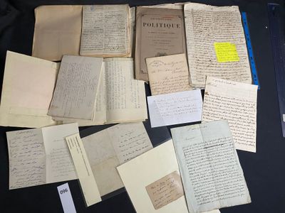 many old papers on a black table with a yellow sticker