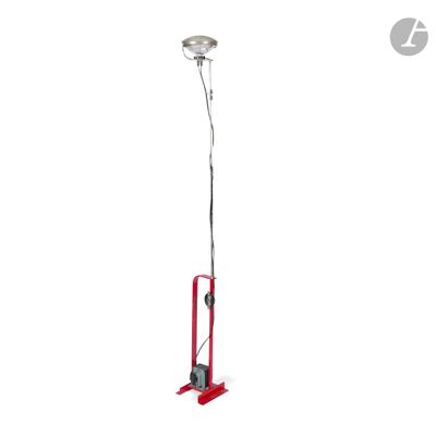a close up of a red floor lamp on a white background