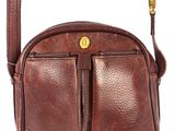 a brown leather cross body bag with a tassel