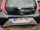 a small car that is parked in a parking lot