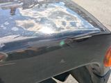 a close up of a car ' s tail light on a street