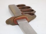 a knife that is sitting on top of a knife holder
