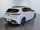 the rear end of a white car in a white room