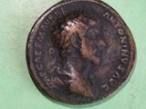 an old coin with a picture of a woman on it