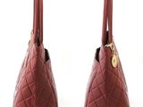 two red handbags on a white background with a white background
