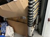 a stack of boxes and a pair of scissors on the floor
