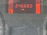a digital clock on the dashboard of a car