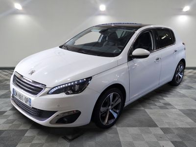 the white car is parked on a checkered floor in the garage