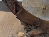 a wooden object that is on a wooden table
