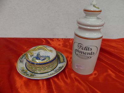 a bottle and a plate on a red table cloth