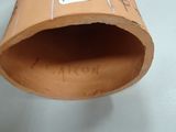 a cardboard tube with a sticker on it