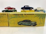 three toy cars are sitting on a table next to each other