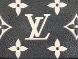 a close up of a black louis vuitton wallet with white flowers on it