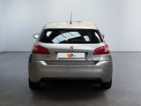 a silver car parked in a room with a white wall