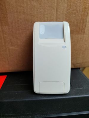 a small white device sitting on top of a black box