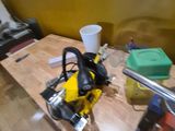 a table with tools on it and a cup on the table