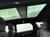 a view of the sunroof in the back seat of a car