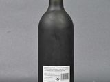 side view of a bottle of wine showing the label on the bottle