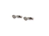pair of diamond stud earrings on white background with copy space