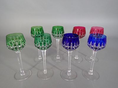 six wine glasses are lined up in a row on a table