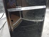 a black toaster oven sitting on top of a counter