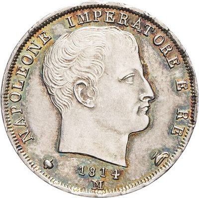 a close up of a coin with a man ' s face on it