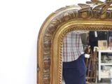 a person standing in front of a mirror in a room