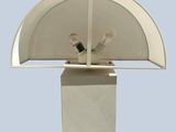 a white table lamp with a white shade on top of it