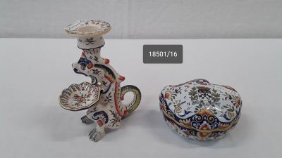 two small vases sitting next to each other on a table