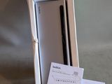 a box with a phone inside of it on a table
