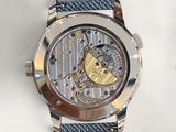 a close up of a watch on a white surface