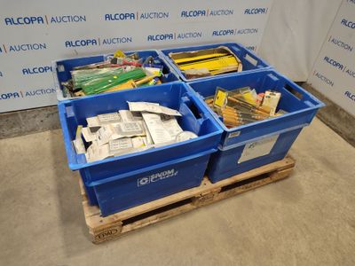 two blue bins filled with assorted items on a pallet