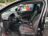 the interior of a car with the door open and the driver ' s seat up