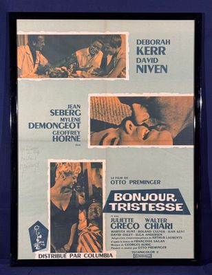 une vieille affiche de cinéma représentant un homme et une femme sur un canapé