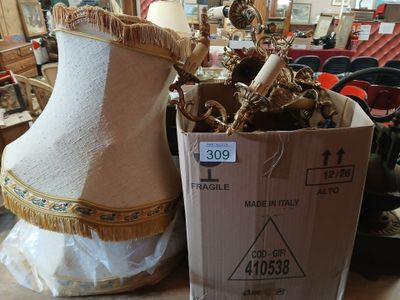 a mannequin in a box next to a mannequin on a table