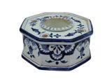a blue and white octagonal shaped box with a mirror in it